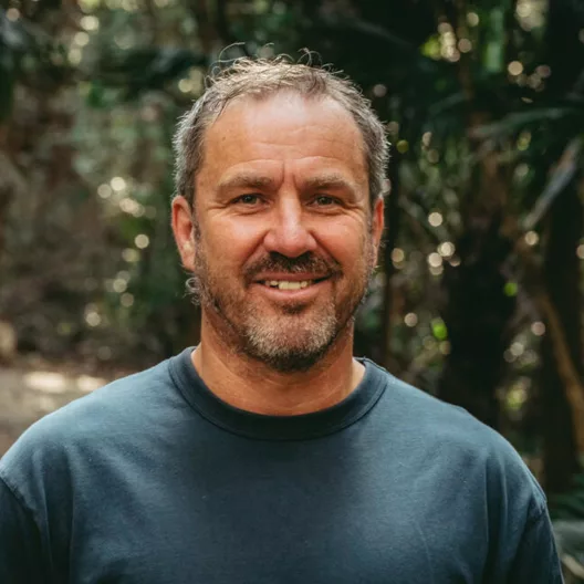 James O'Connor, filmmaker, portrait in lush forest background