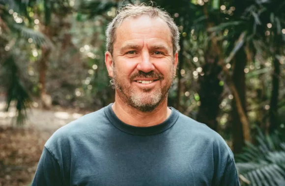 James O'Connor, filmmaker, portrait in lush forest background